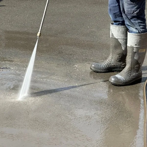 Washing down a freshly finished concrete surface
